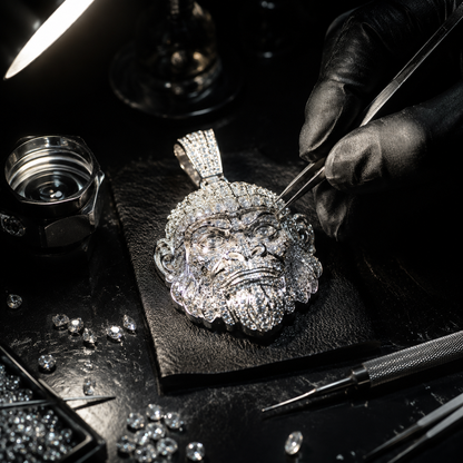 OFF VVS atelier — custom iced-out moissanite piece being hand-set in 925 silver